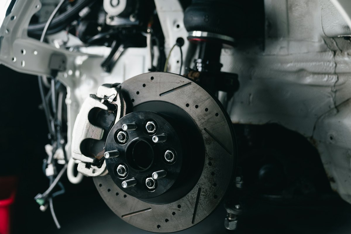 Drilled and slotted performance brake disc with a fixed caliper.